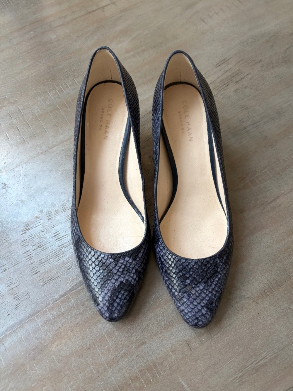 Cole Haan grey and black leather pumps.